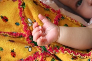 natural baby hand and face