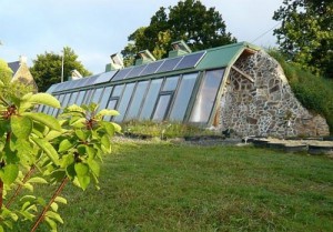 earthship exterior with stone sides