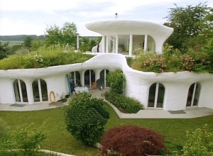 earthship mansion with white exterior