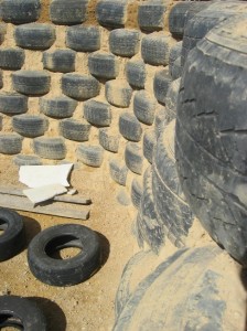 earthship rammed earth tire interior wall close up