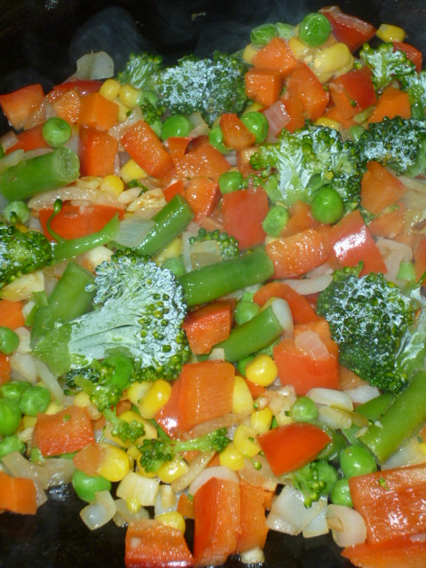 veggie stir fry cooking in the pan